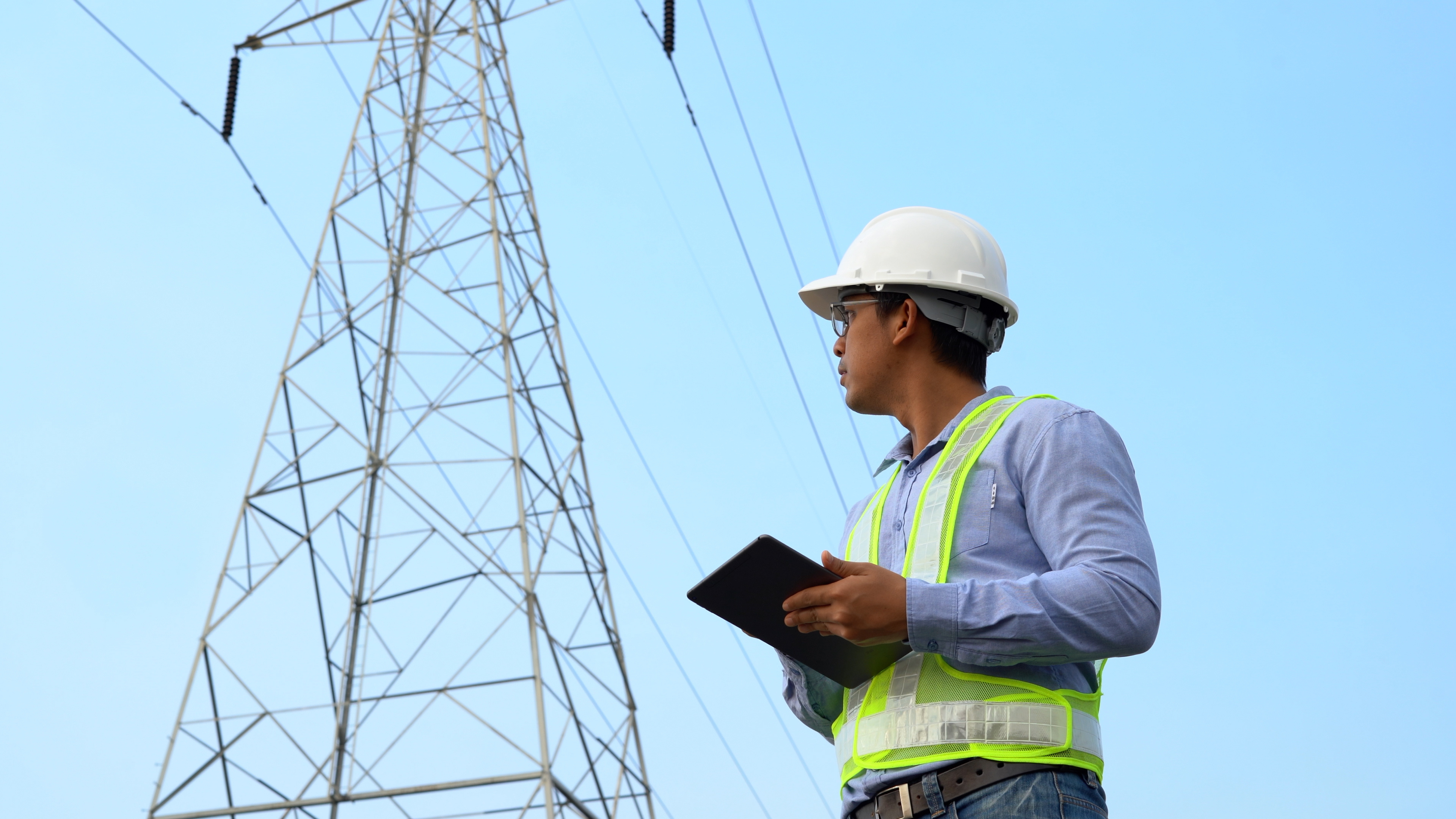 Telecom field technician on tablet