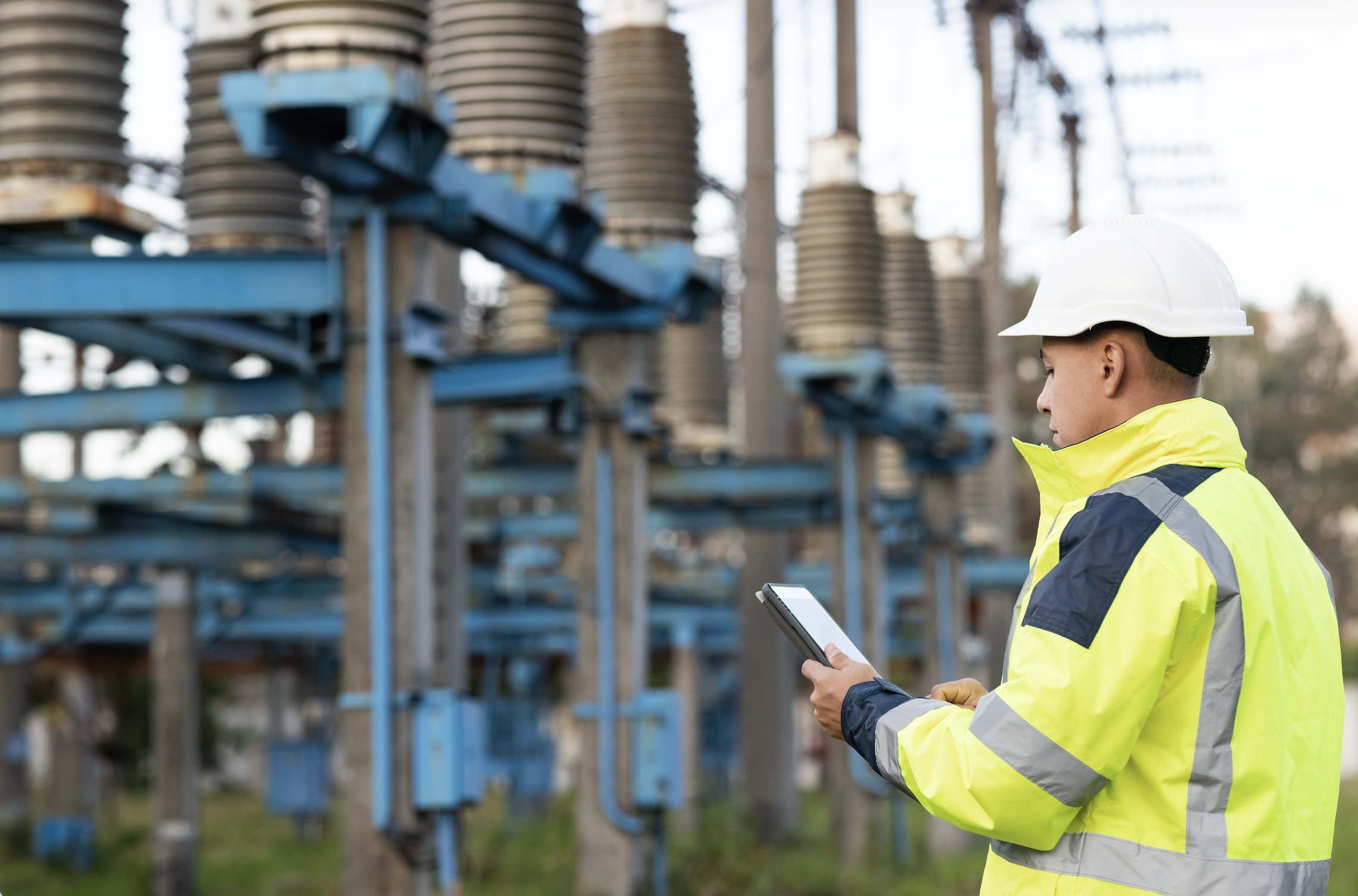 Utility worker checking tablet